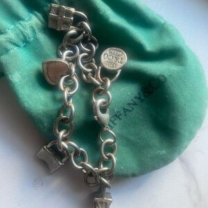 16 years old Tiffany & Co. Sterling Silver Charm Bracelet with Turquoise Pouch